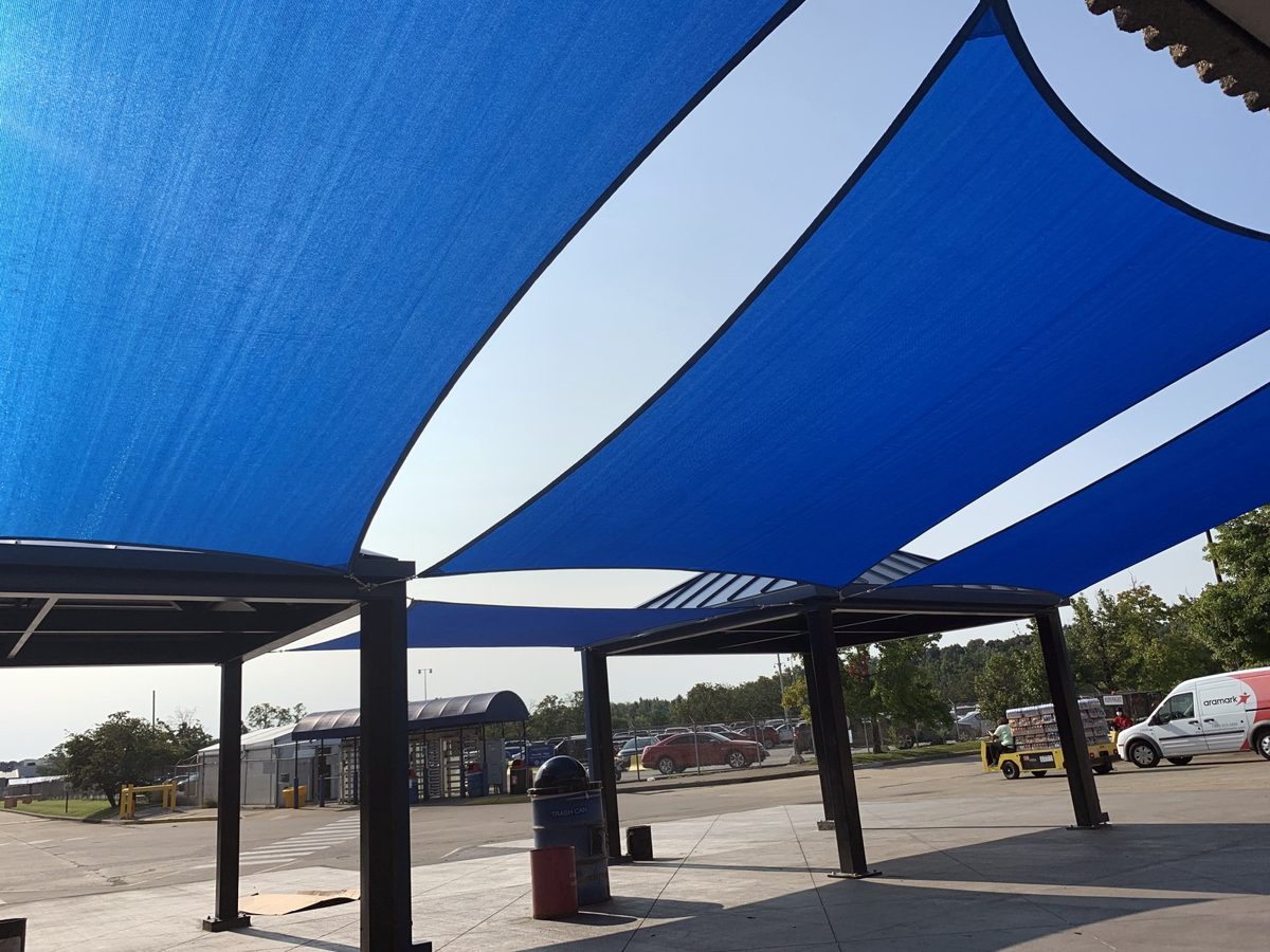 Blue and white rectangle sails on steel posts