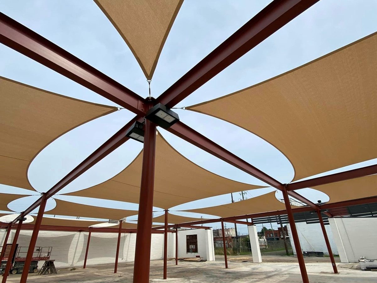 Tan square sails on a steel frame