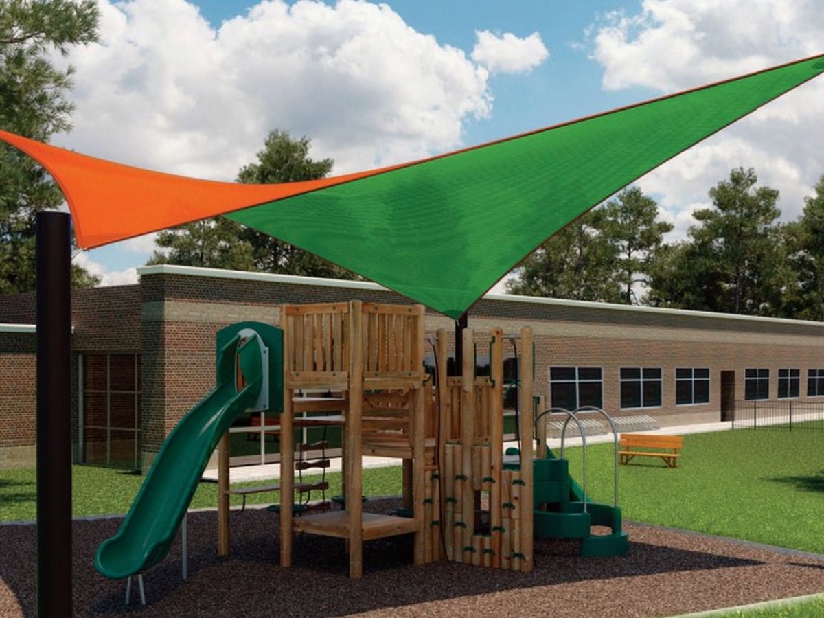 Orange and green square sails over a playground